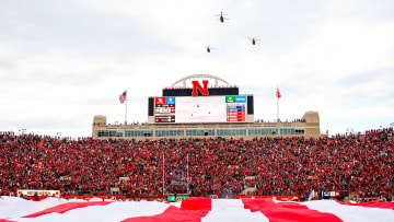 Nov 11, 2023; Lincoln, Nebraska, USA; Three CH-47 Chinook helicopters fly over the field during the