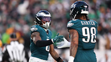 Jan 12, 2025; Philadelphia, Pennsylvania, USA; Philadelphia Eagles safety C.J. Gardner-Johnson (8) and defensive tackle Jalen Carter (98) shake hands after a stop against the Green Bay Packers in an NFC wild card game at Lincoln Financial Field. Mandatory Credit: Bill Streicher-Imagn Images