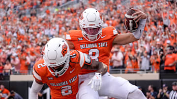 Oklahoma State quarterback Hauss Hejny (8) runs the ball for a touchdown and celebrates with Oklahoma State wide receiver Terrill Davis (2) in the first quarter during an NCAA football game between Oklahoma State (OSU) and UT Martin in Stillwater, Okla., on Thursday, Aug. 28, 2025.