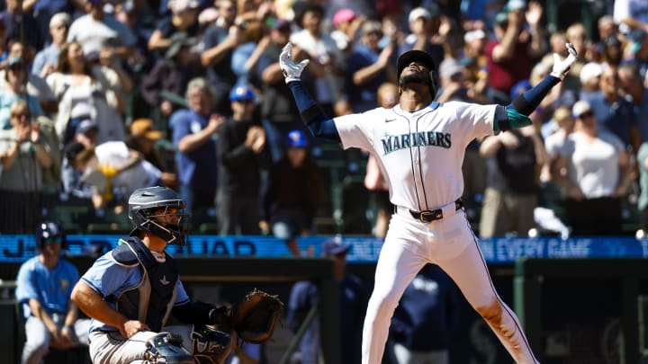 Seattle Mariners right fielder Victor Robles (10) celebrates after hitting a two-run home run against the Tampa Bay Rays during the fifth inning at T-Mobile Park. Tampa Bay Rays catcher Ben Rortvedt (30) squats at left on Aug 28.