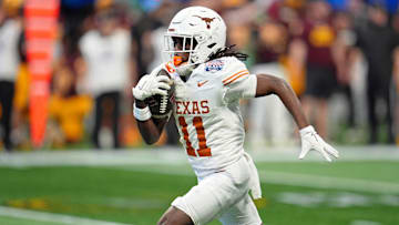 Jan 1, 2025; Atlanta, GA, USA; Texas Longhorns wide receiver Silas Bolden (11) returns a punt for a touchdown against the Arizona State Sun Devils during the first half of the Peach Bowl at Mercedes-Benz Stadium.