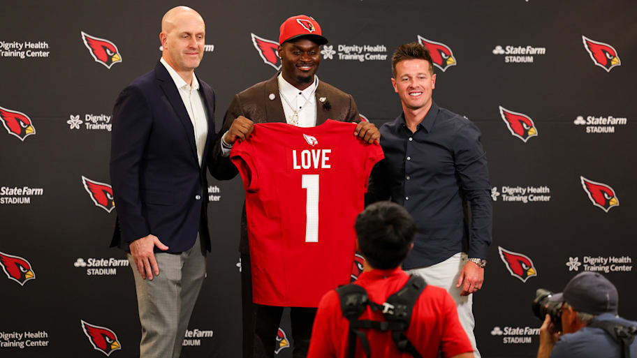 Arizona Cardinals first-round draft pick Jeremiyah Love poses with Arizona Cardinals general manager Monti Ossenfort