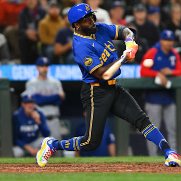 Seattle Mariners outfielder hits a walk-off single during a game against the Texas Rangers on Saturday at T-Mobile Park.