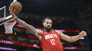 Nov 16, 2025; Houston, Texas, USA; Houston Rockets center Steven Adams (12) grabs a rebound during the first half against the Orlando Magic at Toyota Center. Mandatory Credit: Troy Taormina-Imagn Images
