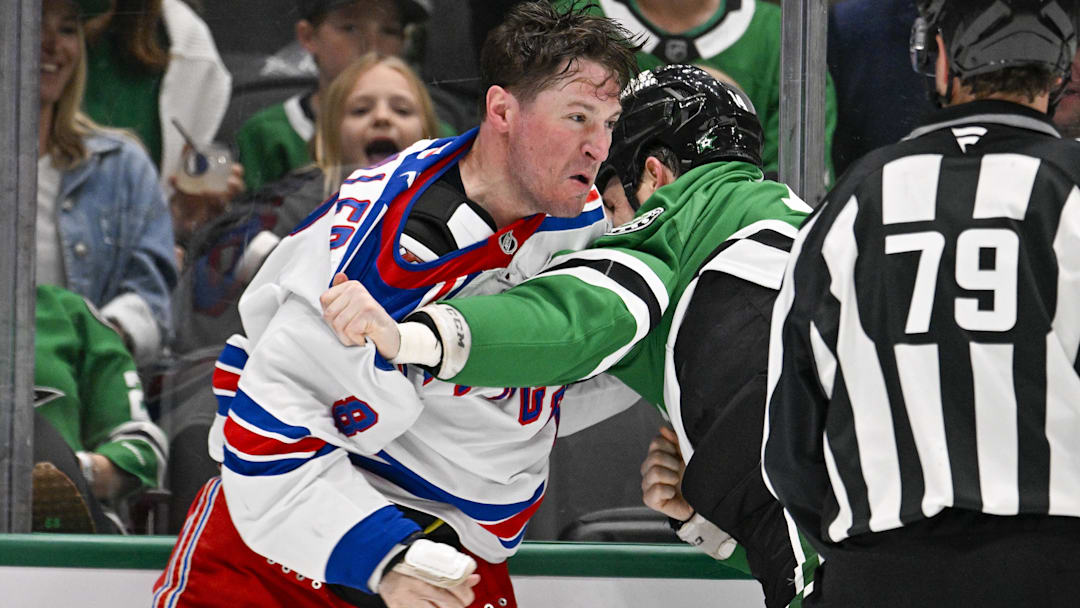 Apr 11, 2026; Dallas, Texas, USA; New York Rangers left wing J.T. Miller (8) fights with Dallas Stars left wing Jamie Benn (14) during the second period at the American Airlines Center. Mandatory Credit: Jerome Miron-Imagn Images