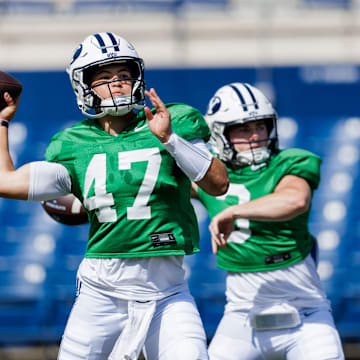BYU quarterbacks Bear Bachmeier and McCae Hillstead warm up for the first scrimmage of Fall Camp