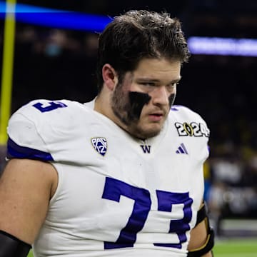 Jan 8, 2024; Houston, TX, USA; Washington Huskies offensive lineman Roger Rosengarten (73) against the Michigan Wolverines during the 2024 College Football Playoff national championship game at NRG Stadium. Mandatory Credit: Mark J. Rebilas-Imagn Images