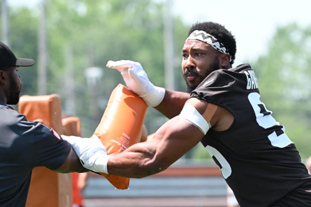 Defensive end rushes in practice drill.