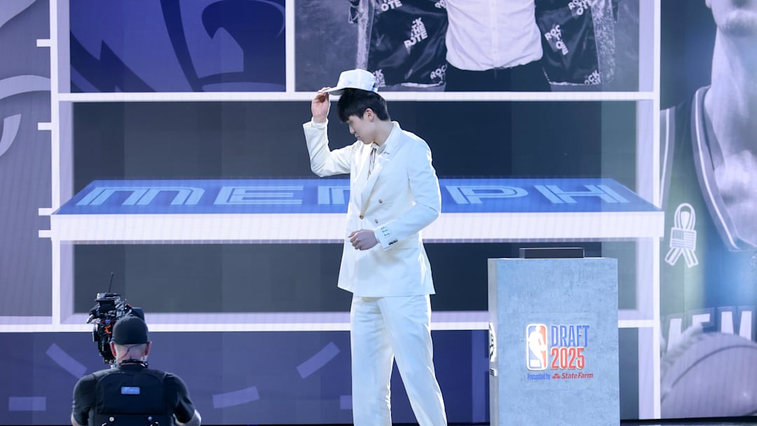 Jun 25, 2025; Brooklyn, NY, USA; Yang Hansen walks on stage after being selected as the 16th pick by the Memphis Grizzlies in the first round of the 2025 NBA Draft at Barclays Center. Mandatory Credit: Brad Penner-Imagn Images Jun 25, 2025; Brooklyn, NY, USA; Yang Hansen walks on stage after being selected as the 16th pick by the Memphis Grizzlies in the first round of the 2025 NBA Draft at Barclays Center. Mandatory Credit: Brad Penner-Imagn Images