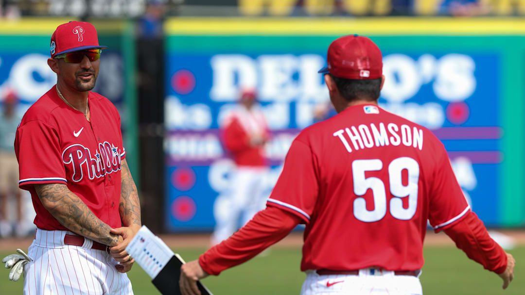 Feb 28, 2023; Clearwater, Florida, USA;  Philadelphia Phillies right fielder Nick Castellanos (8) talks to manager Rob Thomson (59) before a game against the Toronto Blue Jays during spring training at BayCare Ballpark. Mandatory Credit: Nathan Ray Seebeck-Imagn Images