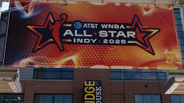 Signs advertising the WNBA All-Star games go up around Gainbridge Fieldhouse.