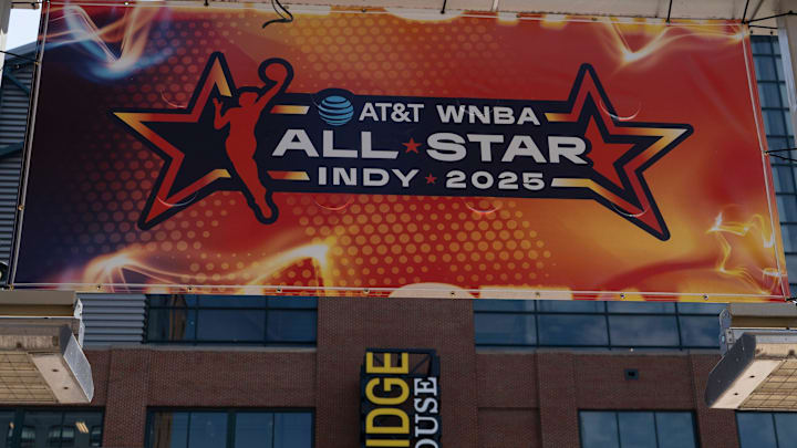 Signs advertising the WNBA All-Star games go up around Gainbridge Fieldhouse.