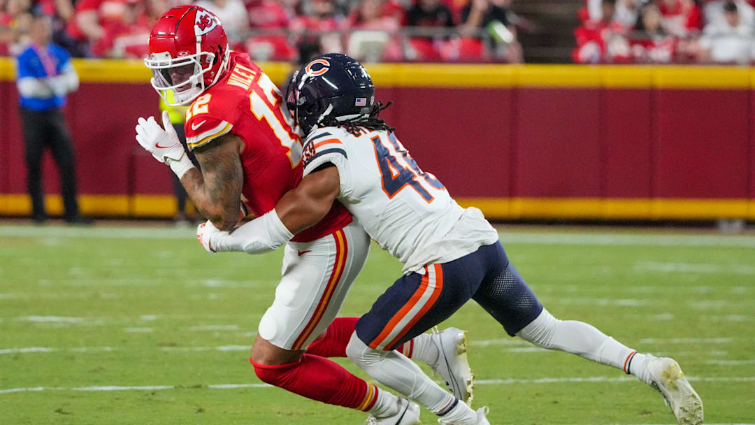 Aug 22, 2024; Kansas City, Missouri, USA; Kansas City Chiefs tight end Jared Wiley (12) catches a pass and is tackled by Chicago Bears cornerback Reddy Steward (46) during the first half at GEHA Field at Arrowhead Stadium. Mandatory Credit: Denny Medley-Imagn Images