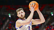 Feb 15, 2025; Salt Lake City, Utah, USA; Kansas Jayhawks center Hunter Dickinson (1) recovers a rebound against the Utah Utes during the second half at the Jon M. Huntsman Center.