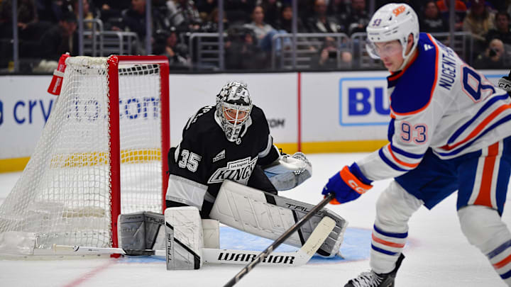 Dec 28, 2024; Los Angeles, California, USA; Los Angeles Kings goaltender Darcy Kuemper (35) defends the goal against Edmonton Oilers center Ryan Nugent-Hopkins (93) during the third period at Crypto.com Arena. Mandatory Credit: Gary A. Vasquez-Imagn Images