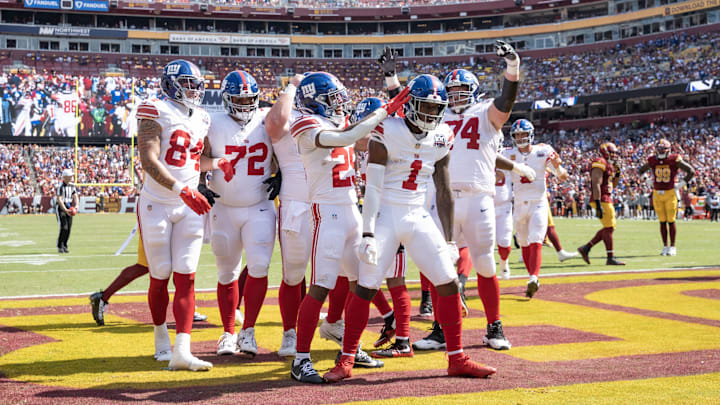 Sep 15, 2024; Landover, Maryland, USA; New York Giants wide receiver Malik Nabers (1) celebrates with teammates after catching a touchdown pass in the first half against the Washington Commanders at Commanders Field. 