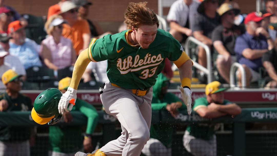 Feb 23, 2026; Scottsdale, Arizona, USA; Athletics right fielder Henry Bolte (33) runs to first against the San Francisco Giants in the third inning at Scottsdale Stadium. Mandatory Credit: Rick Scuteri-Imagn Images
