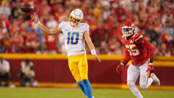 Sep 15, 2022; Kansas City, Missouri, USA; Los Angeles Chargers quarterback Justin Herbert (10) struggles throwing against the Kansas City Chiefs during the second half at GEHA Field at Arrowhead Stadium. Mandatory Credit: Jay Biggerstaff-USA TODAY Sports
