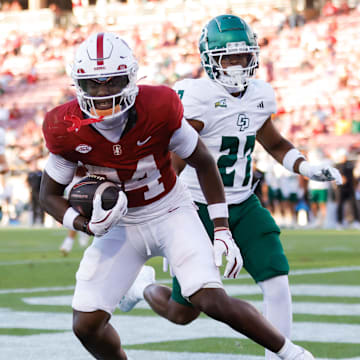 Sep 7, 2024; Stanford, California, USA; Stanford Cardinal wide receiver Ismael Cisse (84) scores a touchdown against the Cal Poly Mustangs during the second half at Stanford Stadium. Mandatory Credit: Sergio Estrada-Imagn Images