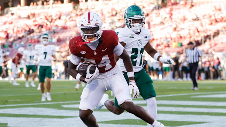 Sep 7, 2024; Stanford, California, USA; Stanford Cardinal wide receiver Ismael Cisse (84) scores a touchdown against the Cal Poly Mustangs during the second half at Stanford Stadium. Mandatory Credit: Sergio Estrada-Imagn Images