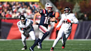 Nov 2, 2025; Foxborough, Massachusetts, USA; New England Patriots quarterback Drake Maye (10) scrambles with the ball against the Atlanta Falcons during the first quarter at Gillette Stadium. Mandatory Credit: Brian Fluharty-Imagn Images