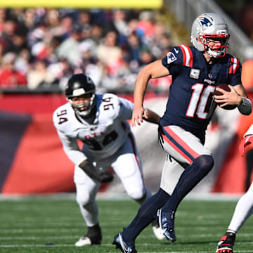 Nov 2, 2025; Foxborough, Massachusetts, USA; New England Patriots quarterback Drake Maye (10) scrambles with the ball against the Atlanta Falcons during the first quarter at Gillette Stadium. Mandatory Credit: Brian Fluharty-Imagn Images