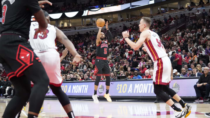 Nov 18, 2023; Chicago, Illinois, USA; Chicago Bulls guard Jevon Carter (5) makes a three point