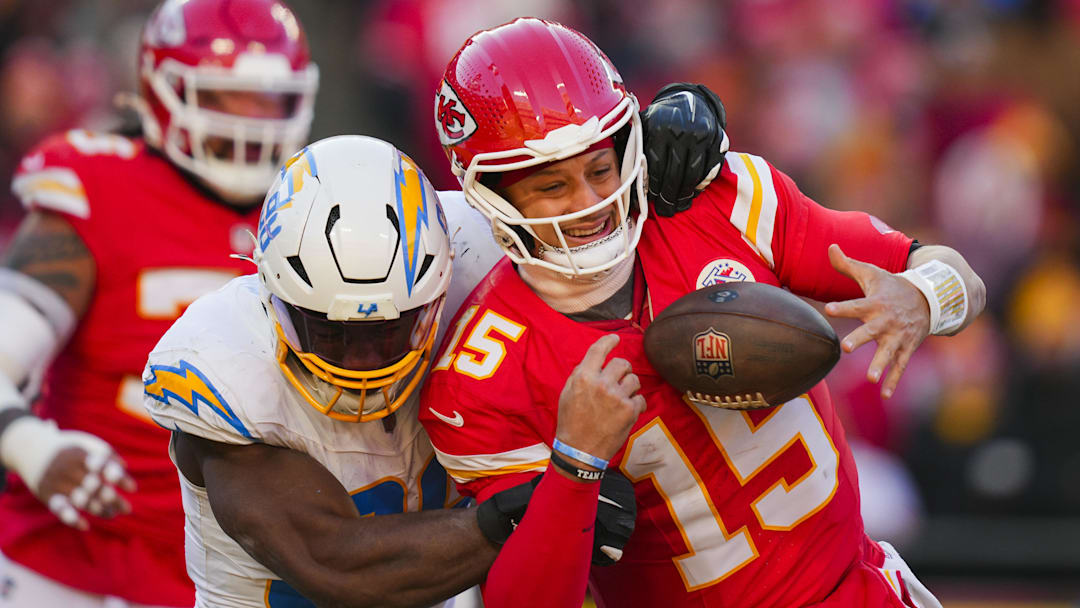 Dec 14, 2025; Kansas City, Missouri, USA; Kansas City Chiefs quarterback Patrick Mahomes (15) is sacked by Los Angeles Chargers linebacker Odafe Oweh (98) during the second half at GEHA Field at Arrowhead Stadium. Mandatory Credit: Jay Biggerstaff-Imagn Images Dec 14, 2025; Kansas City, Missouri, USA; Kansas City Chiefs quarterback Patrick Mahomes (15) is sacked by Los Angeles Chargers linebacker Odafe Oweh (98) during the second half at GEHA Field at Arrowhead Stadium. Mandatory Credit: Jay Biggerstaff-Imagn Images