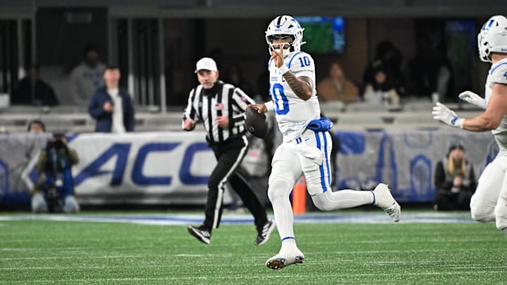 Dec 6, 2025; Charlotte, NC, USA; Duke Blue Devils quarterback Darian Mensah (10) looks to throw in the second quarter against the Virginia Cavaliers during the 2025 ACC Championship game at Bank of America Stadium. Mandatory Credit: Bob Donnan-Imagn Images