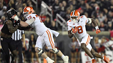 Nov 14, 2025; Louisville, Kentucky, USA;  Clemson Tigers running back Adam Randall (8) runs the ball against the Louisville Cardinals during the second half at L&N Federal Credit Union Stadium. Clemson defeated Louisville 20-19. Mandatory Credit: Jamie Rhodes-Imagn Images