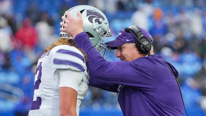 Oct 25, 2025; Lawrence, Kansas, USA; Kansas State Wildcats head coach Chris Klieman congratulates quarterback Avery Johnson (2) after he scores against the Kansas Jayhawks during the second half of the game at David Booth Kansas Memorial Stadium. Mandatory Credit: Denny Medley-Imagn Images
