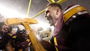 Nov 29, 2025; Minneapolis, Minnesota, USA; Minnesota Golden Gophers quarterback Drake Lindsey (5) celebrates with Paul Bunyan’s Axe after the game against the Wisconsin Badgers at Huntington Bank Stadium. Mandatory Credit: Matt Krohn-Imagn Images