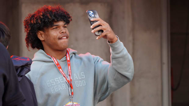 Freshman Jonah Williams watches Ohio State warm up before playing against Penn State on Oct. 21, 2023 at Ohio Stadium.