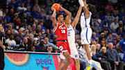 Feb 23, 2025; Memphis, Tennessee, USA; Florida Atlantic Owls forward Baba Miller (18) looks to pass against Memphis Tigers guard Tyrese Hunter (11) during the first half at FedExForum. Mandatory Credit: Wesley Hale-Imagn Images