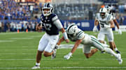 Aug 30, 2025; Provo, Utah, USA;  Brigham Young Cougars quarterback Bear Bachmeier (47) runs for a touchdown against Portland State Vikings defensive back Pierce Walker (3) during the second quarter at LaVell Edwards Stadium. Mandatory Credit: Rob Gray-Imagn Images