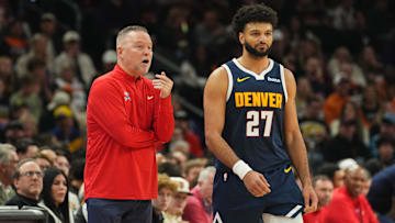 Dec 25, 2024; Phoenix, Arizona, USA; Denver Nuggets head coach Michael Malone talks with Denver Nuggets guard Jamal Murray (27) during the first half against the Phoenix Suns at Footprint Center. Mandatory Credit: Joe Camporeale-Imagn Images