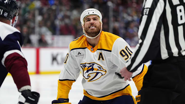 Jan 16, 2026; Denver, Colorado, USA; Nashville Predators center Ryan O'Reilly (90) reacts to getting kicked out of the face-off in the third period against the Nashville Predators at Ball Arena. Mandatory Credit: Ron Chenoy-Imagn Images