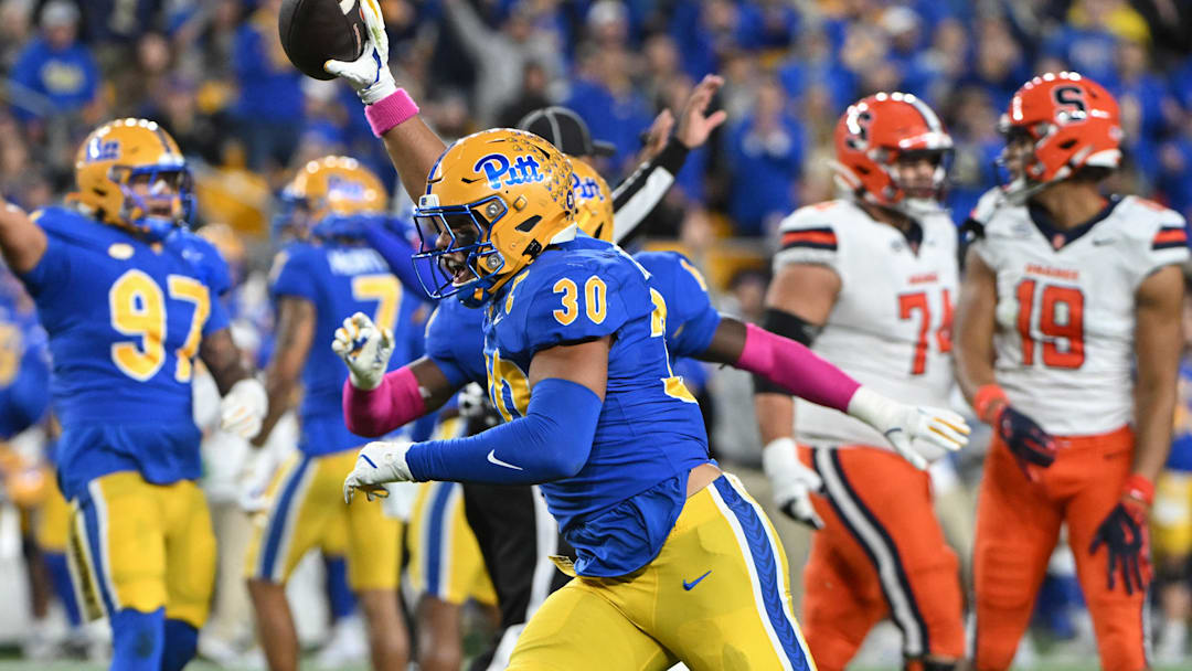 Oct 24, 2024; Pittsburgh, Pennsylvania, USA; Pittsburgh Panthers linebacker Brandon George (30) celebrates and interception against the Syracuse Orange during the first quarter  at Acrisure Stadium. Mandatory Credit: Barry Reeger-Imagn Images