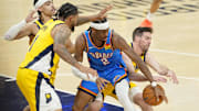 Oklahoma City Thunder guard Shai Gilgeous-Alexander loses control of the ball against Obi Toppin and T.J. McConnell.
