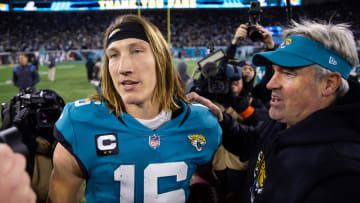 Jan 14, 2023; Jacksonville, Florida, USA; Jacksonville Jaguars quarterback Trevor Lawrence (16) celebrates with head coach Doug Pederson at TIAA Bank Field. Mandatory Credit: Mark J. Rebilas-USA TODAY Sports