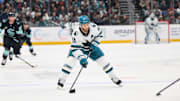 Jan 30, 2025; Seattle, Washington, USA; San Jose Sharks center Luke Kunin (11) advances the puck against the Seattle Kraken during the second period at Climate Pledge Arena. Mandatory Credit: Steven Bisig-Imagn Images