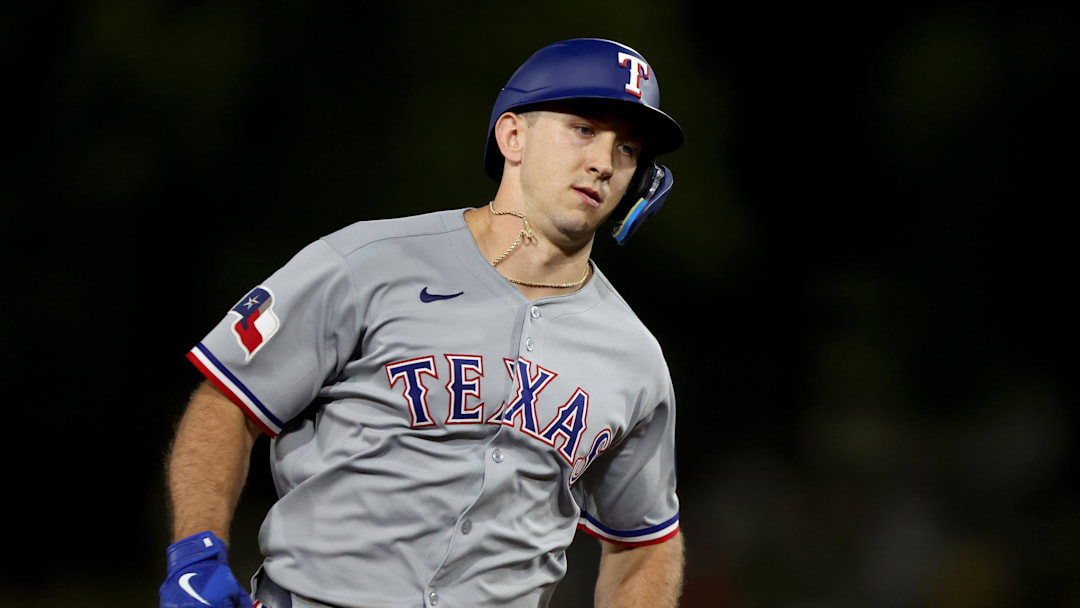 Texas Rangers left fielder Wyatt Langford rounds the bases. 