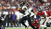 Oct 21, 2024; Tampa, Florida, USA; Baltimore Ravens running back Derrick Henry (22) runs with the ball against the Tampa Bay Buccaneers in the fourth quarter at Raymond James Stadium. Mandatory Credit: Nathan Ray Seebeck-Imagn Images