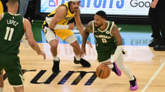 Milwaukee Bucks guard Damian Lillard dribbles to the rim.