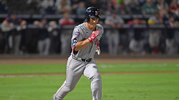 Boston Red Sox designated hitter Masataka Yoshida singles against the Tampa Bay Rays.