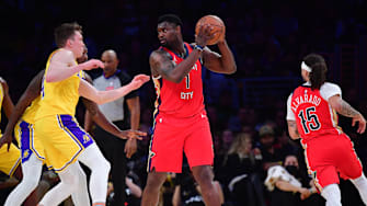 Mar 4, 2025; Los Angeles, California, USA; New Orleans Pelicans forward Zion Williamson (1) controls the ball against Los Angeles Lakers guard Dalton Knecht (4) during the first half at Crypto.com Arena. Mandatory Credit: Gary A. Vasquez-Imagn Images