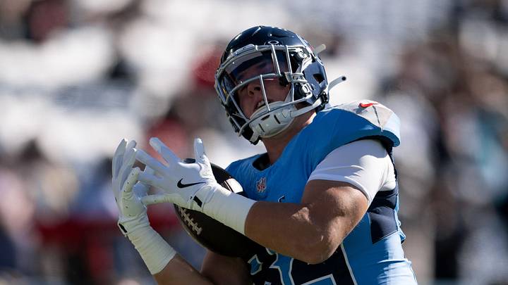 Nov 16, 2025; Nashville, Tennessee, USA;  Tennessee Titans tight end Gunnar Helm (84) makes a catch against the Houston Texans during pre-game warmups at Nissan Stadium. Mandatory Credit: Steve Roberts-Imagn Images
