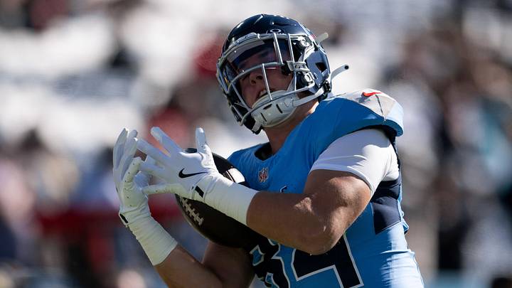 Nov 16, 2025; Nashville, Tennessee, USA;  Tennessee Titans tight end Gunnar Helm (84) makes a catch against the Houston Texans during pre-game warmups at Nissan Stadium. Mandatory Credit: Steve Roberts-Imagn Images
