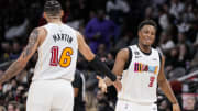 Nov 27, 2022; Atlanta, Georgia, USA; Miami Heat guard Kyle Lowry (7) reacts with forward Caleb Martin (16) after making a three point basket against the Atlanta Hawks during the second half at State Farm Arena. Mandatory Credit: Dale Zanine-USA TODAY Sports