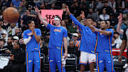 Dec 7, 2025; Salt Lake City, Utah, USA; The Oklahoma City Thunder bench react after a shot against the Utah Jazz during the first quarter at Delta Center. Mandatory Credit: Rob Gray-Imagn Images